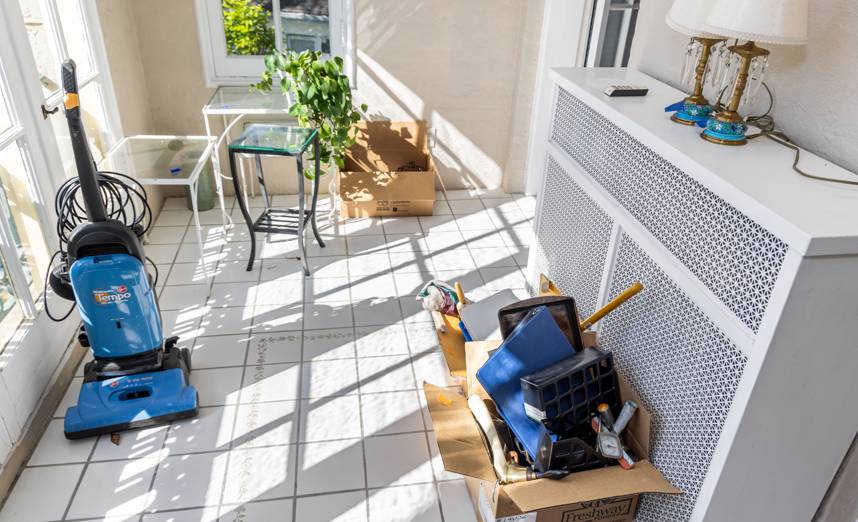 Household items and boxes staged for removal during a Rockville property cleanout