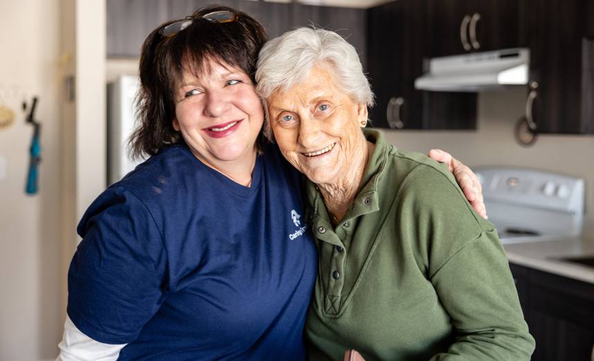 Caring Transitions move manager and a senior client after settling into a new Arlington home
